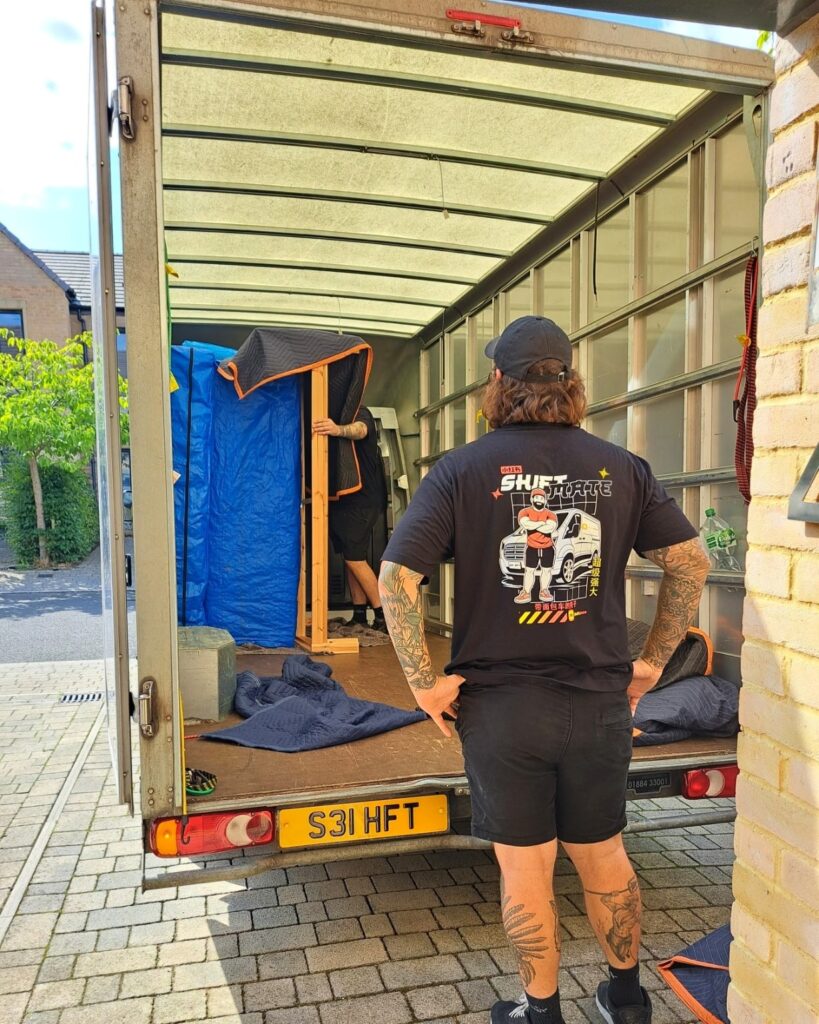 House removals Birmingham team loading furniture into van