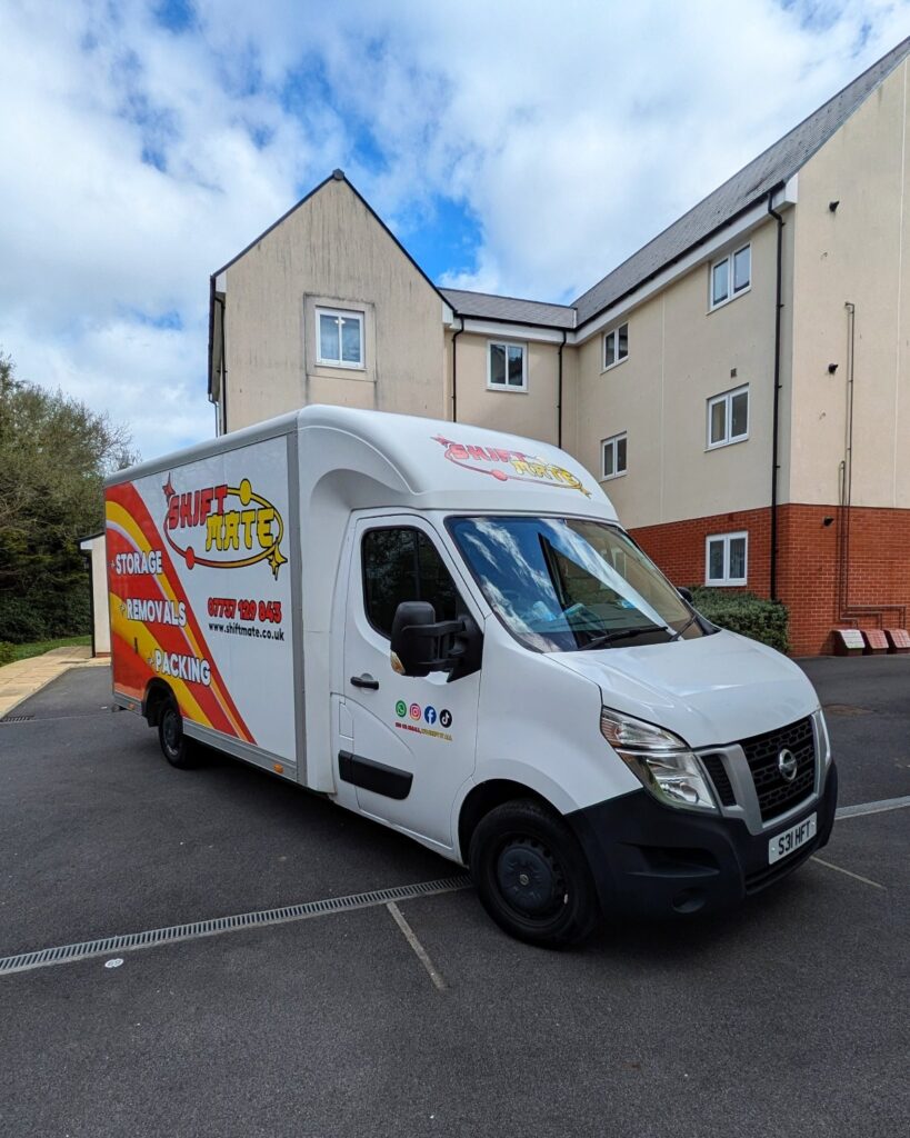 ShiftMate Removals van parked outside residential flats during a house removal in Birmingham