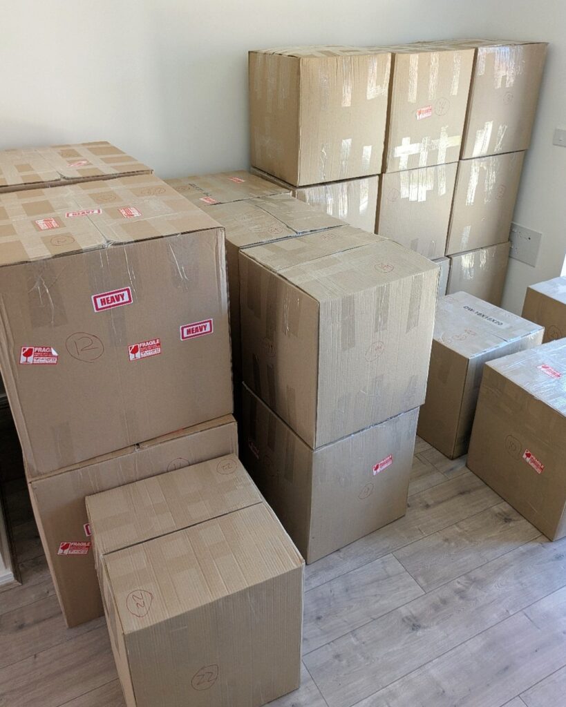 Packed moving boxes prepared for a house move in Birmingham