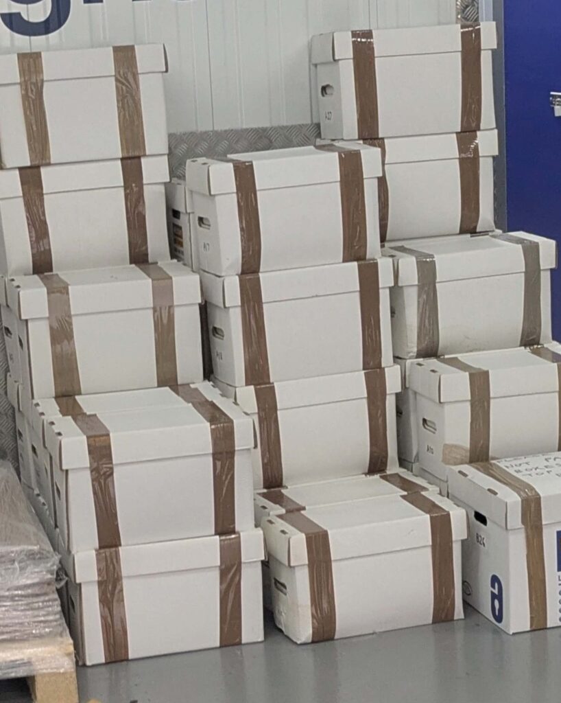 Stacked archive and storage boxes organised for transport and storage in Birmingham