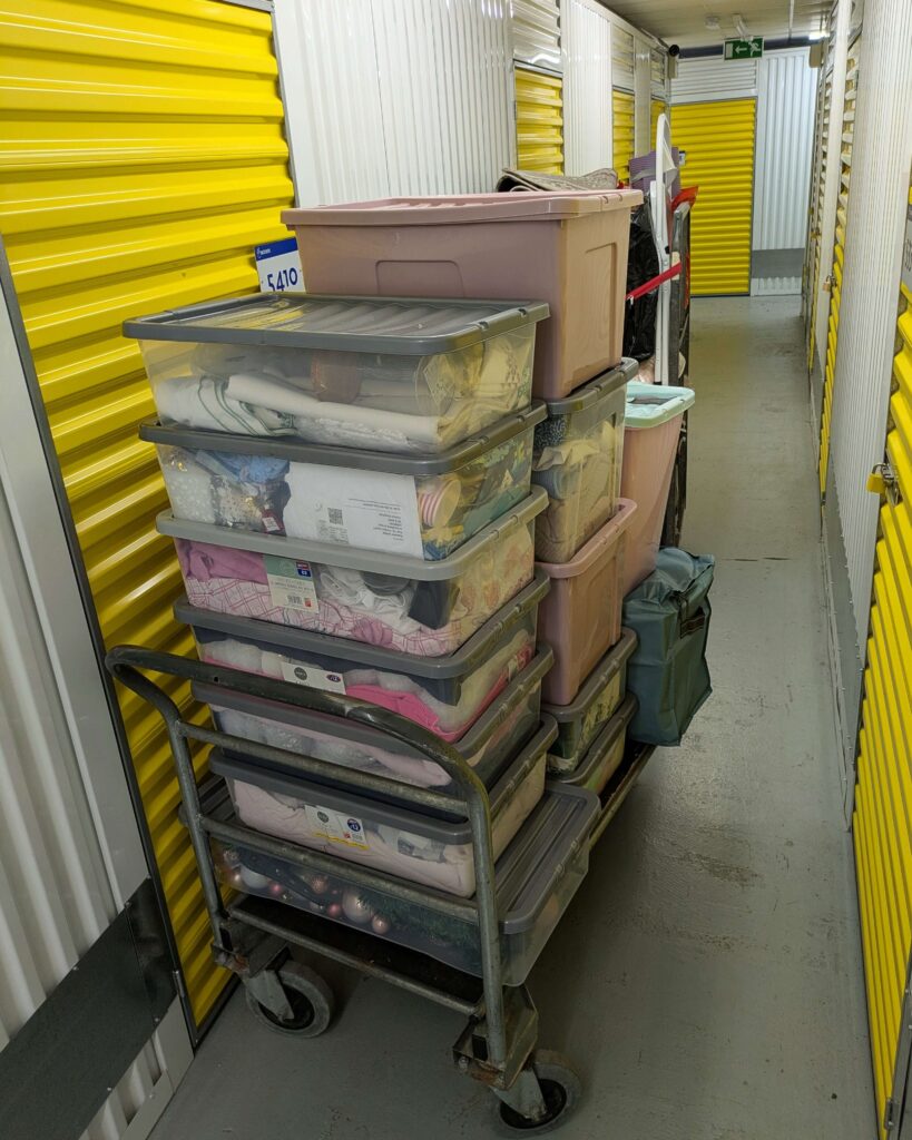 Storage trolley loaded with household belongings inside indoor self storage facility in Birmingham