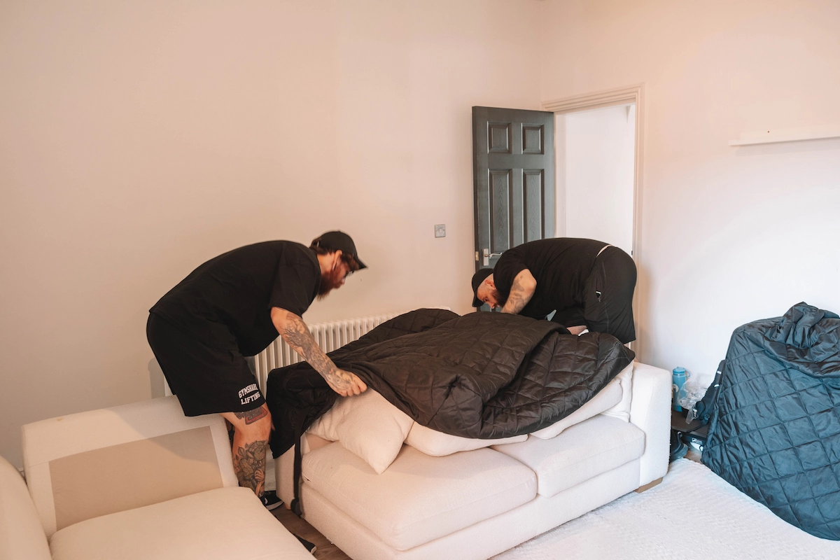 ShiftMate Removals team protecting furniture before a house move