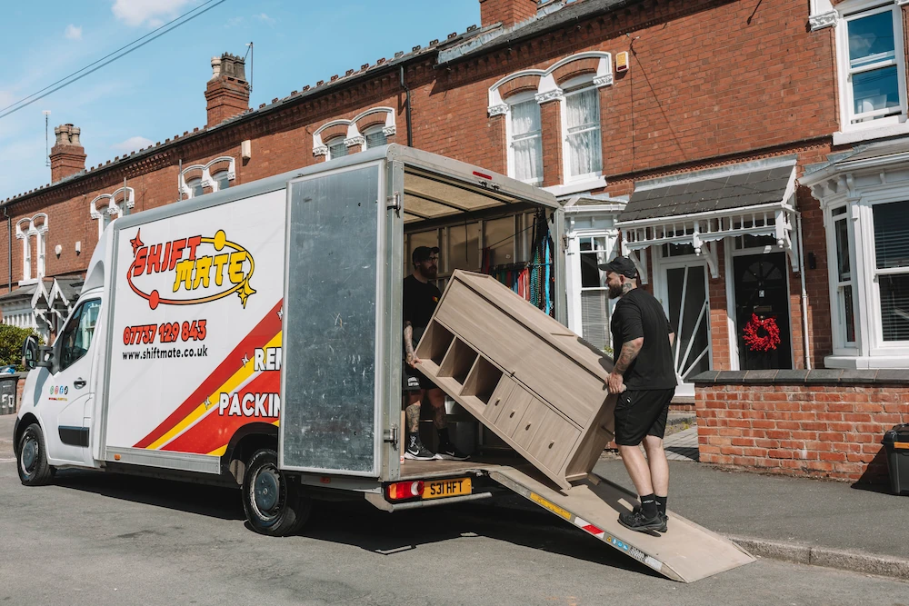 ShiftMate team loading protected furniture inside a removals van