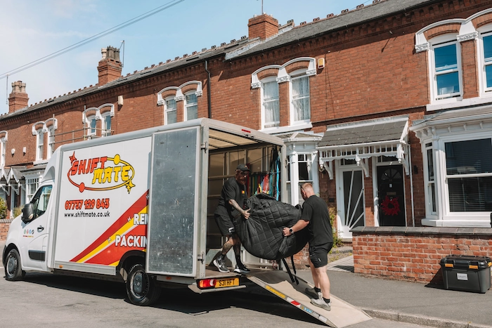 ShiftMate removals van and moving team working outside a customer’s home