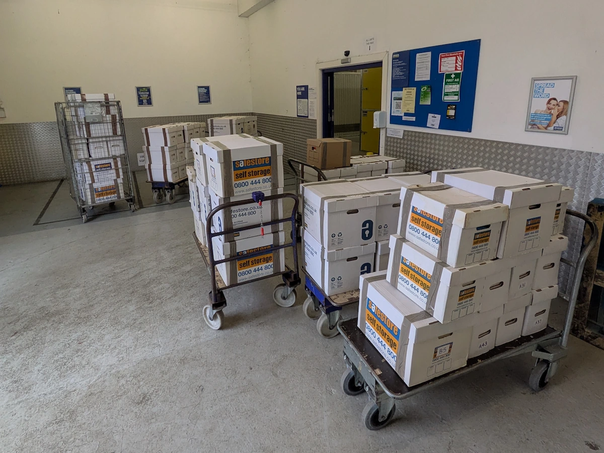Trolleys loaded with customer boxes inside a Birmingham storage facility