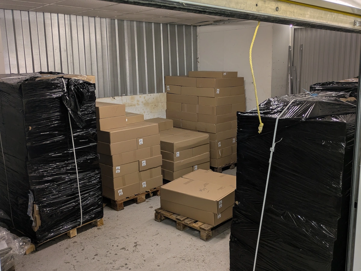 Boxes and wrapped furniture inside a unit used for ShiftMate storage services in Birmingham