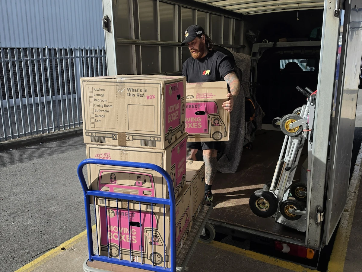 ShiftMate team member unloading boxes from a van for storage in Birmingham